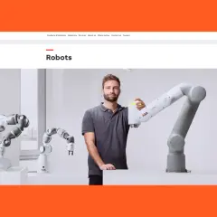 A man stands with several robotic arms, showcasing automation solutions of America.