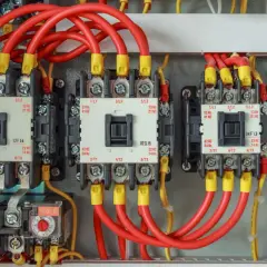 Close-up of IEC motor starters, showing the wiring and contactors. These are the most common components used in motor starter circuits.