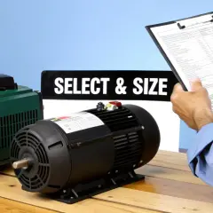 A person reviews a document next to a green VFD and a black motor. The sign "SELECT & SIZE" is visible, hinting at the importance of VFD carrier frequency.