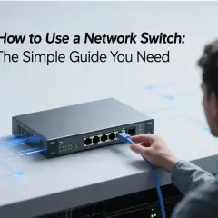A man connects a blue Ethernet cable to a network switch, illustrating how to configure a network switch for optimal connectivity.