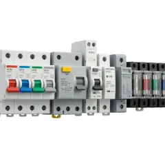 A row of electrical circuit protection devices, including MCBs, RCDs, RCBOs, AFDDs, and an SPD, all mounted on a DIN rail.