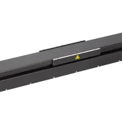 A long, black linear stage actuator with warning symbols.