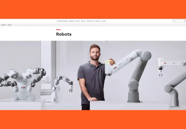 A man stands with several robotic arms, showcasing automation solutions of America.
