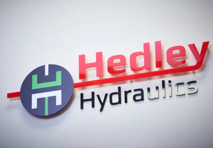 Hedley Hydraulics logo with red "Hedley" and silver "Hydraulics" text, and a circular emblem. This company is an empire in fluid power.