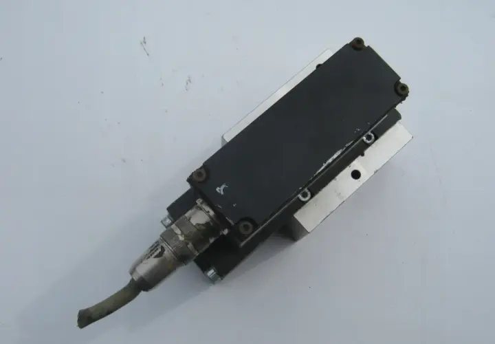 A Numatics Inc. pneumatic actuator with a cable connector.