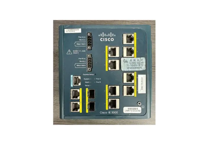 Close-up of a Cisco IE 3000 8TC industrial Ethernet switch, showing its ports and labels.