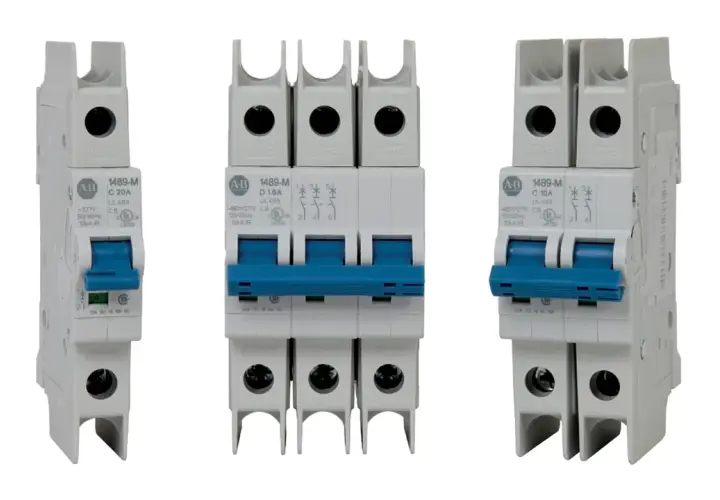 Three white circuit breakers with blue toggles. The middle one is a triple-pole slow blow circuit breaker, while the outer two are single-pole.