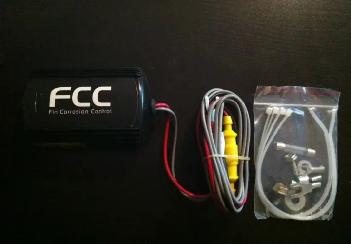 FCC Fin Corrosion Control unit with wiring and hardware. Special enclosures are required to protect motor controllers from corrosion.