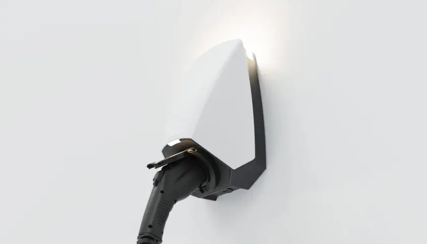 A sleek white and black electric vehicle charger, branded "SEREN," is mounted on a white wall, ready to power up.