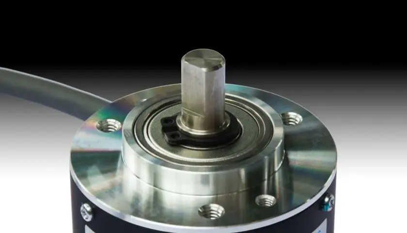 Close-up of a rotary encoder, a key component from an encoder products company, showcasing its precision shaft and bearing assembly.