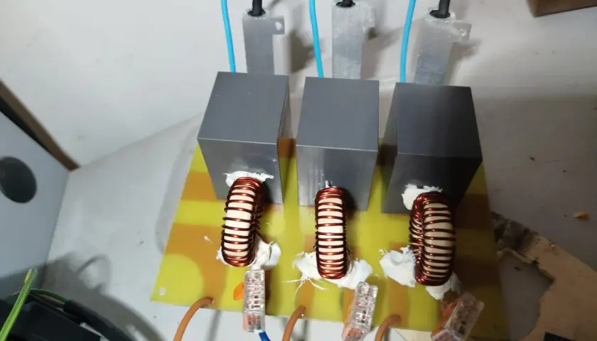 Three inductors mounted on a circuit board, part of a DIY VFD filters setup.