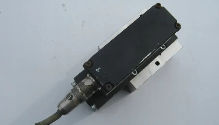 A Numatics Inc. pneumatic actuator with a cable connector.