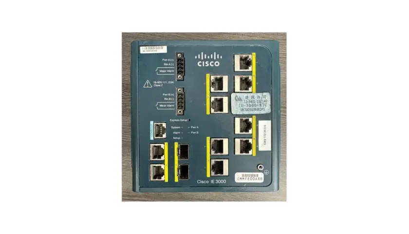 Close-up of a Cisco IE 3000 8TC industrial Ethernet switch, showing its ports and labels.