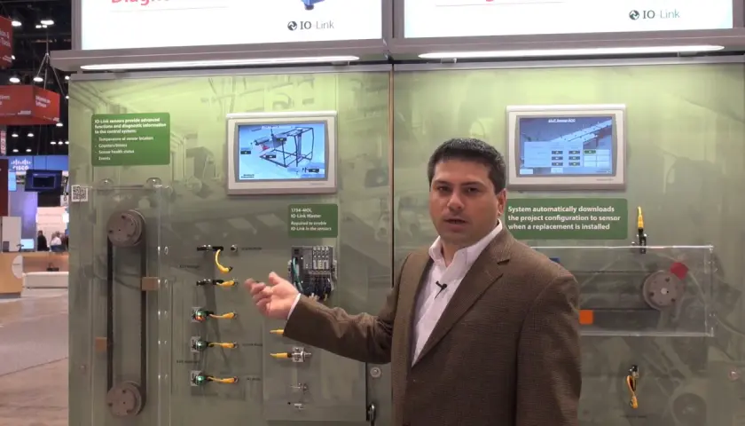 Man explains IO-Link Master with Ethernet/IP, showcasing sensor data and automatic configuration for industrial automation.