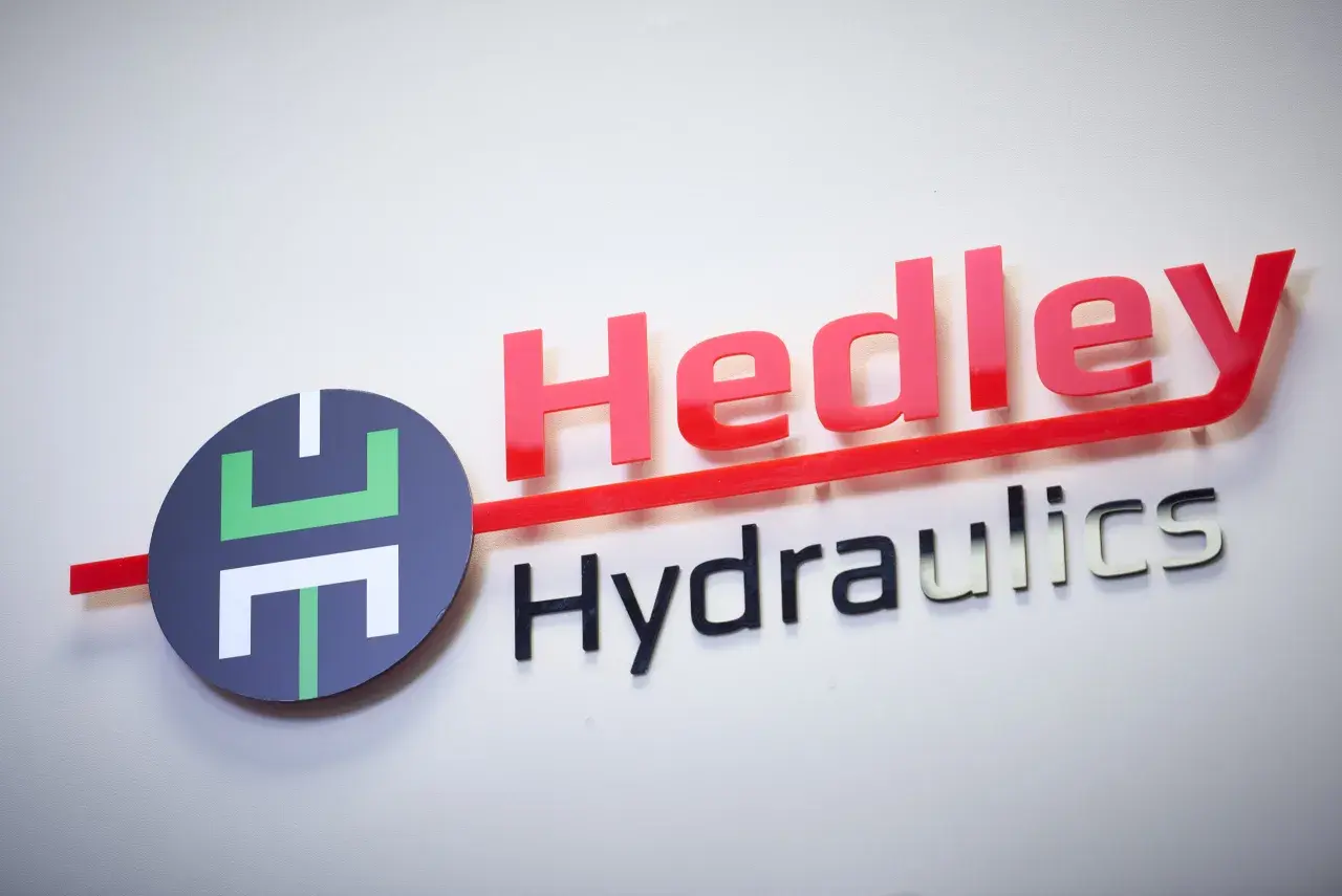 Hedley Hydraulics logo with red "Hedley" and silver "Hydraulics" text, and a circular emblem. This company is an empire in fluid power.