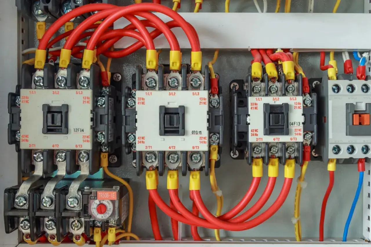 Close-up of IEC motor starters, showing the wiring and contactors. These are the most common components used in motor starter circuits.