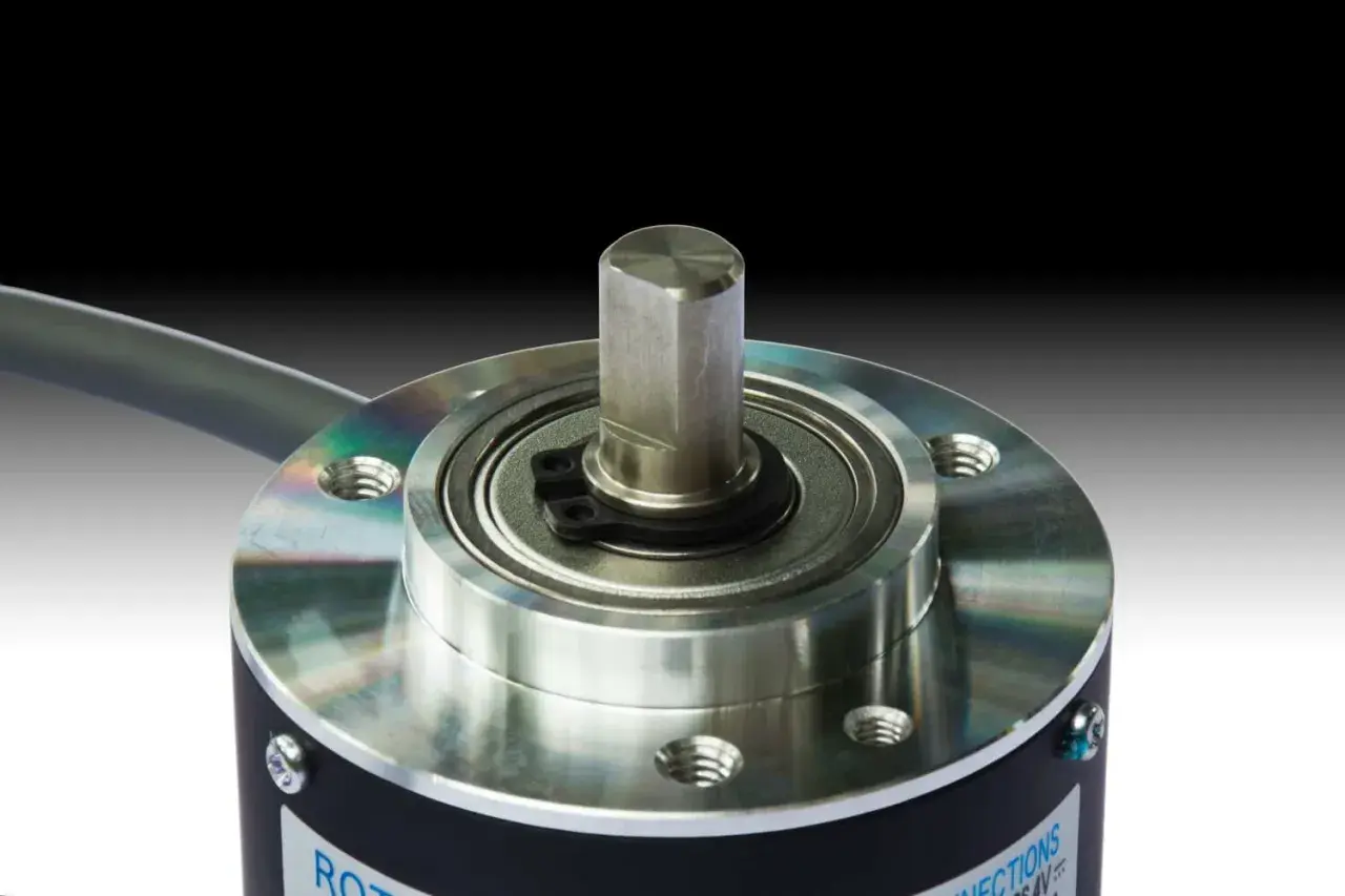 Close-up of a rotary encoder, a key component from an encoder products company, showcasing its precision shaft and bearing assembly.