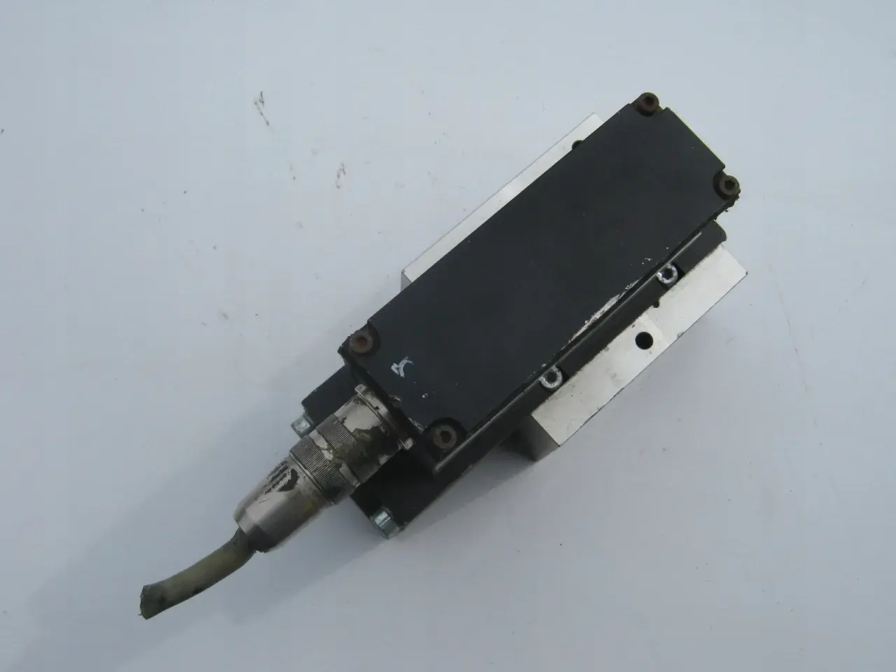 A Numatics Inc. pneumatic actuator with a cable connector.
