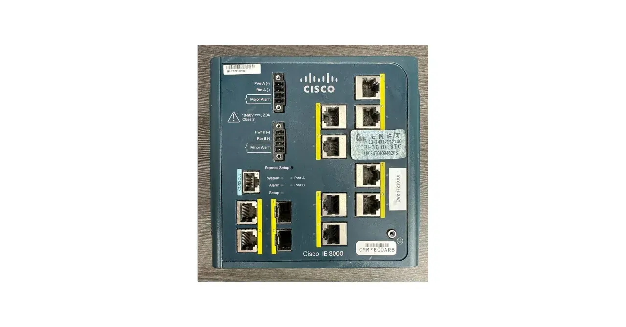 Close-up of a Cisco IE 3000 8TC industrial Ethernet switch, showing its ports and labels.