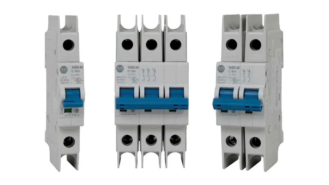 Three white circuit breakers with blue toggles. The middle one is a triple-pole slow blow circuit breaker, while the outer two are single-pole.