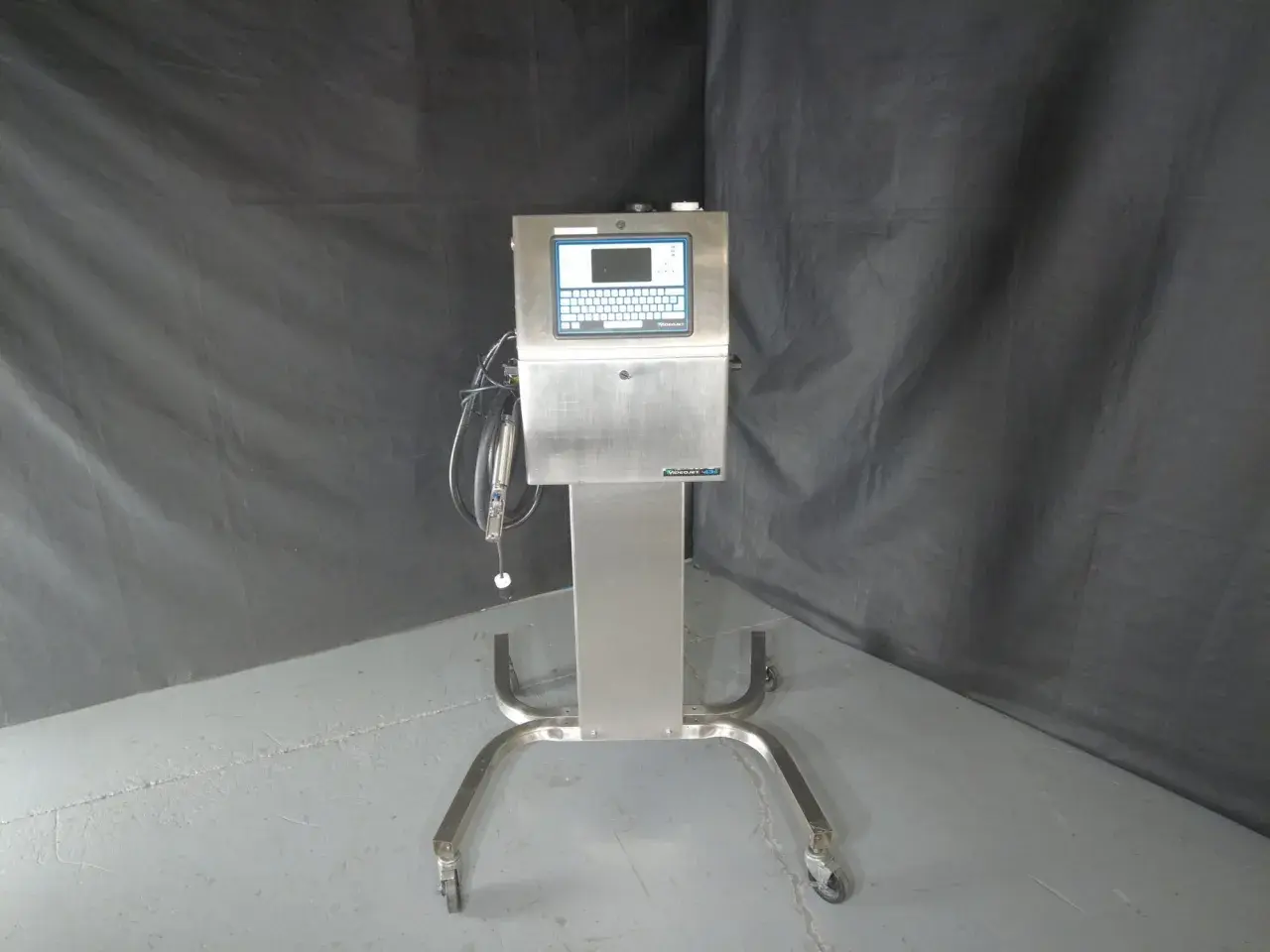 A Videojet Technologies Inc. industrial printer on a wheeled stand, ready for production.