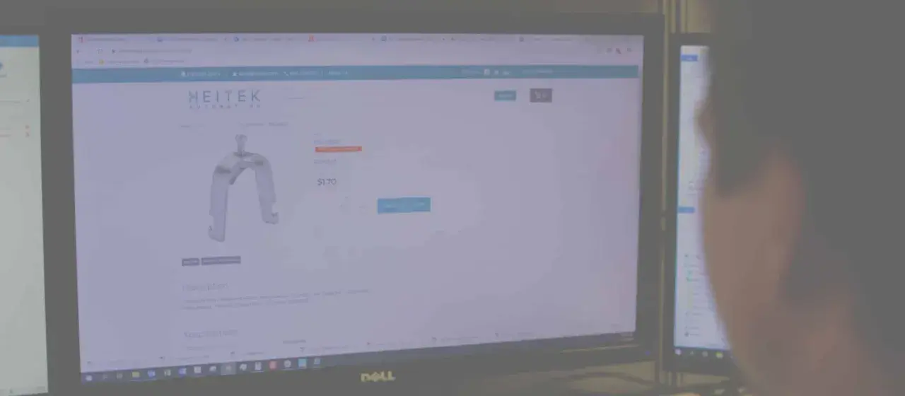 A person views a Heitek Automation website displaying a metal bracket for $1.70.