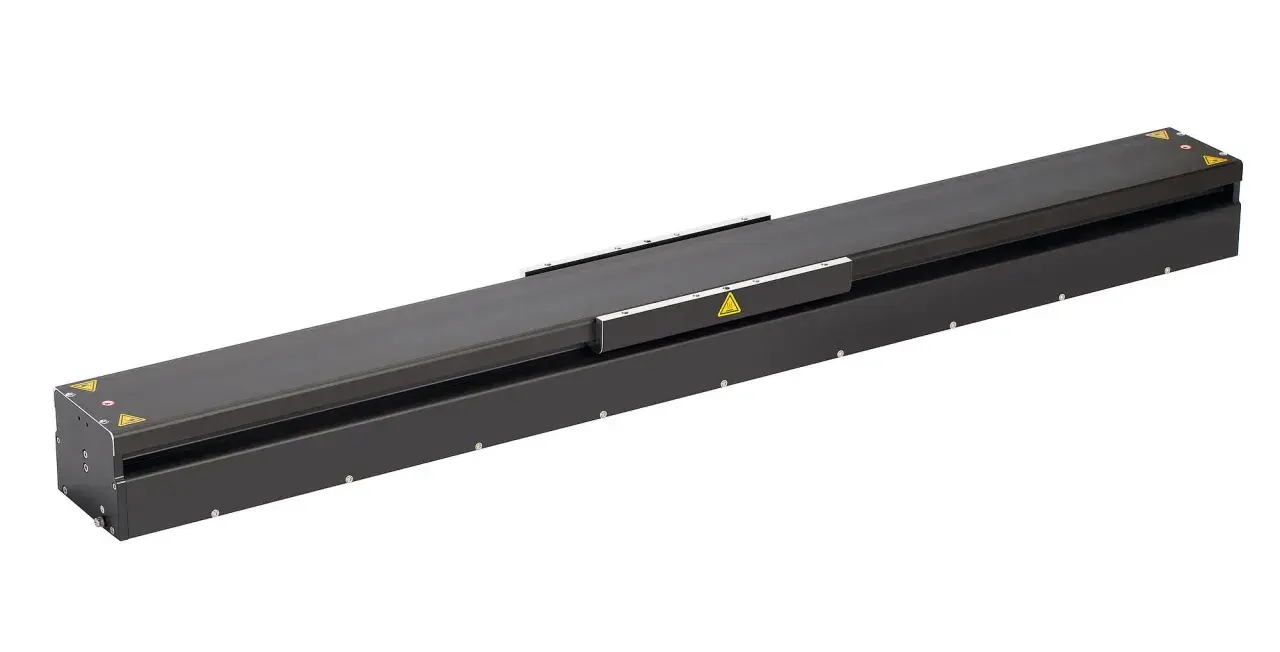A long, black linear stage actuator with warning symbols.