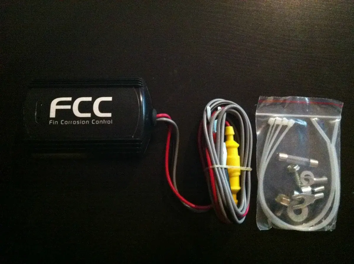 FCC Fin Corrosion Control unit with wiring and hardware. Special enclosures are required to protect motor controllers from corrosion.