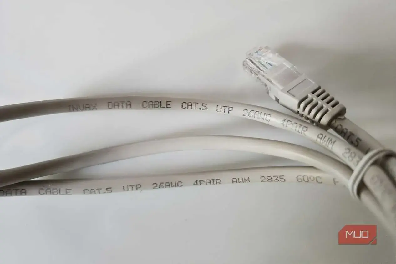 Two grey Cat.5 ethernet cables are shown, one with an RJ45 connector. The text on the cables indicates they are suitable for data transmission, with no mention of minimum ethernet cable length.