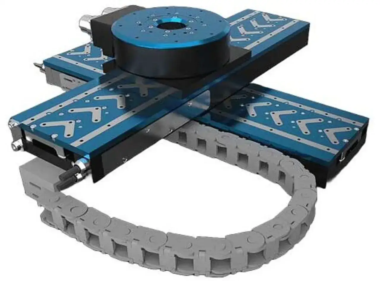 Precision motion system featuring a linear stage actuator with a blue rotary stage and a cable management chain.