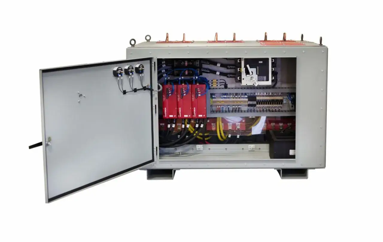 Open electrical panel showcasing complex wiring and control concepts, Inc. components.