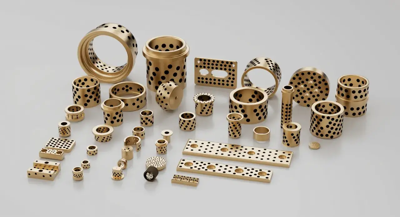 A collection of bronze bearings with black dimples, resembling glacier garlock bearings, are displayed on a white surface.